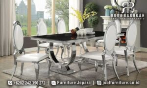 Meja Makan Mewah Stainless Modena Kesan Refined FS-990 dengan kaki berbentuk lengkung dan finishing doff chrome, hadirkan elegan dan nyaman untuk ruang makan Anda.
