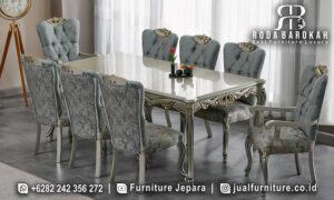 Jual Meja Makan Mewah Noblesse Kerajinan Jepara FS1122 yang elegan dengan kaki meja ukiran dan finishing doff gold, sempurna untuk ruang makan minimalis modern Anda.